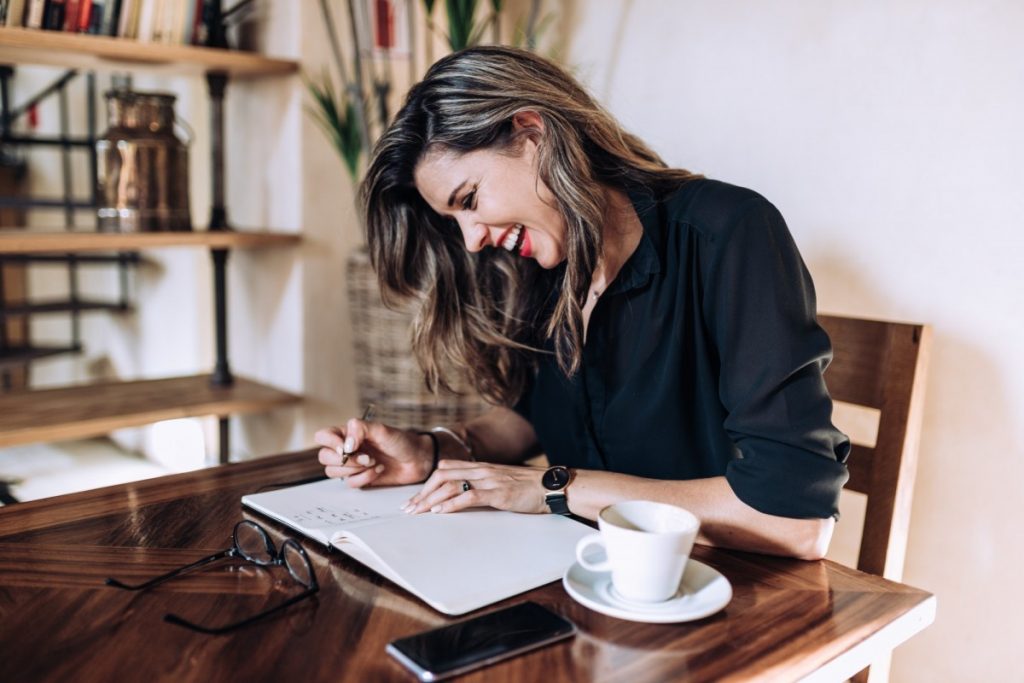 Attractive business woman having fun while working