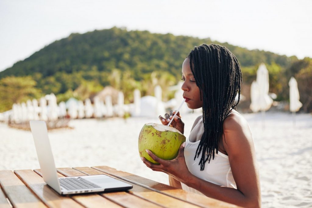 Woman drinking refreshing coconut water