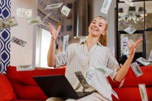 The girl made a lot of money online from home. Easy money concept